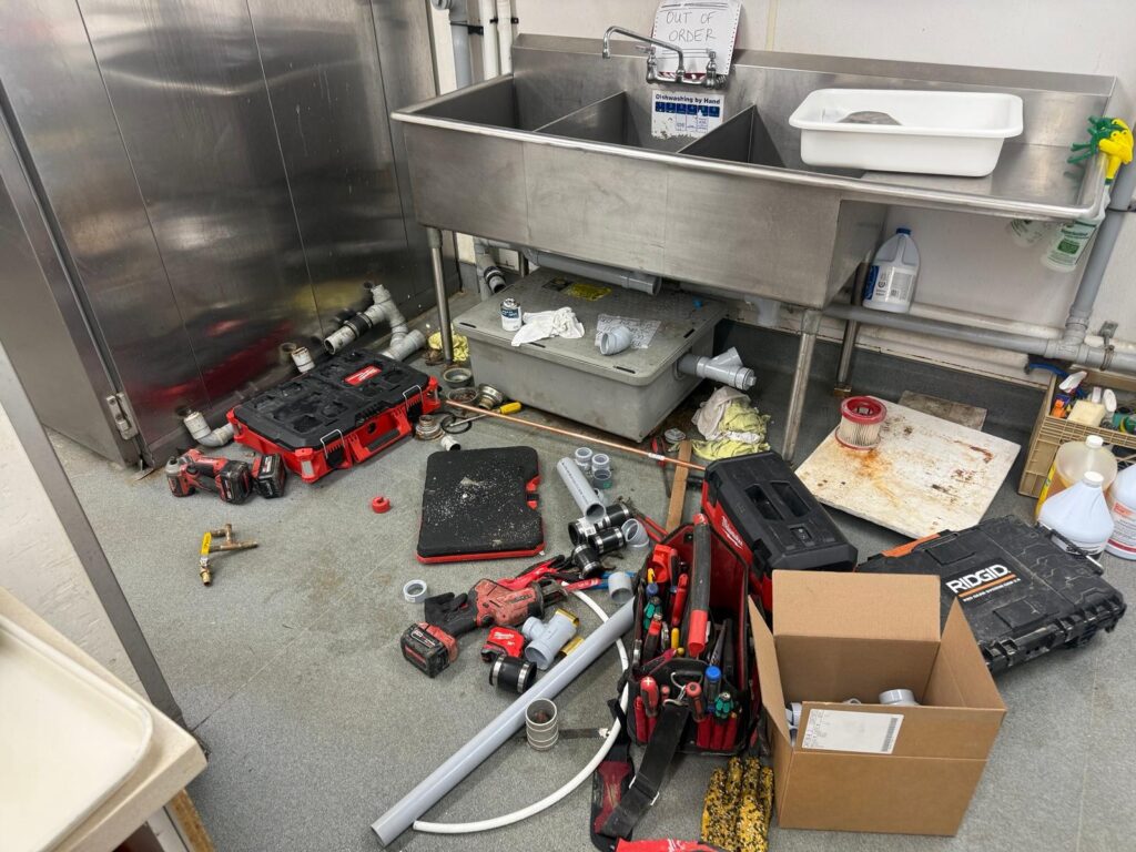 plumber in Winnipeg working on residential plumbing system