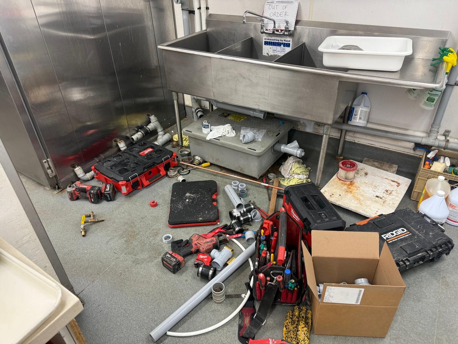 plumber in Winnipeg working on residential plumbing system